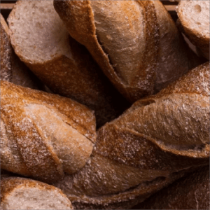 a pile of many loaves of bread
